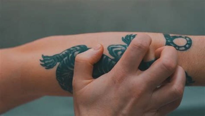 Unveiling the Mystery Behind the Scratching Tattoo in My Sleeve